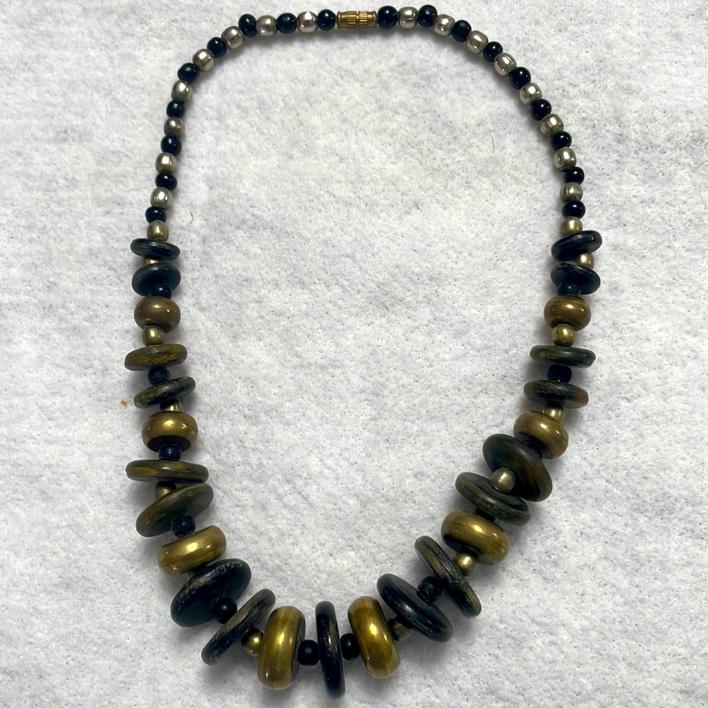 Necklace. Wooden and metal beads and discs of various sizes. 20” long